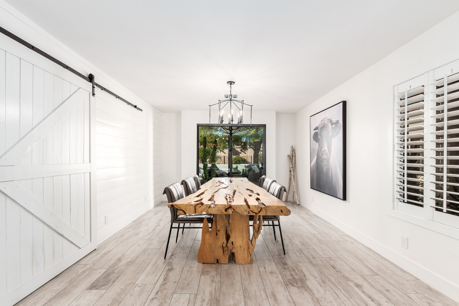 Custom dining area with natural light and live-edge table in Mesa home by Kitchens by Good Guys.