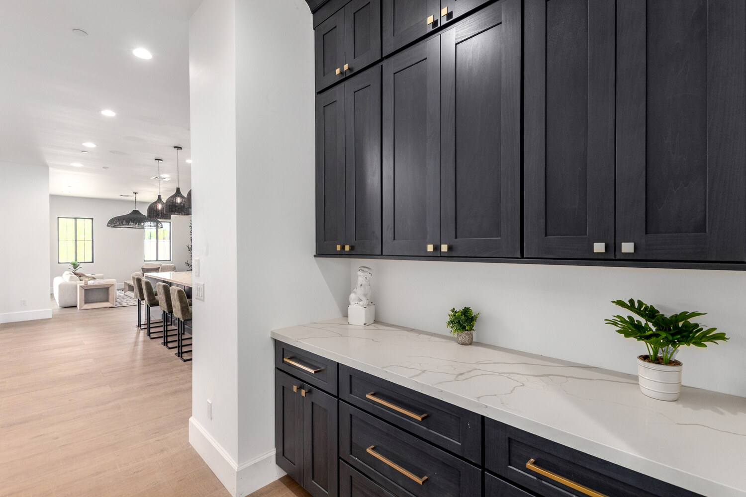 Black cabinetry and white quartz countertop in modern Scottsdale custom home by Kitchens by Good Guys.