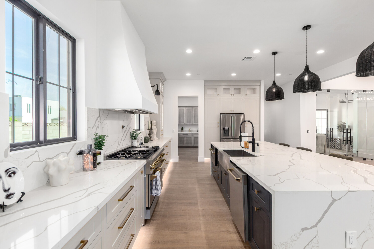Custom pantry kitchen with light wood cabinets and marble countertops in Scottsdale by Kitchens by Good Guys.
