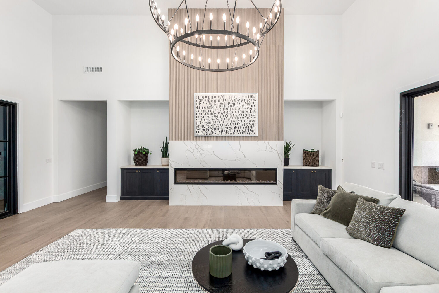 Grand custom home great room in Scottsdale by Kitchens by Good Guys with full wall windows and open concept.