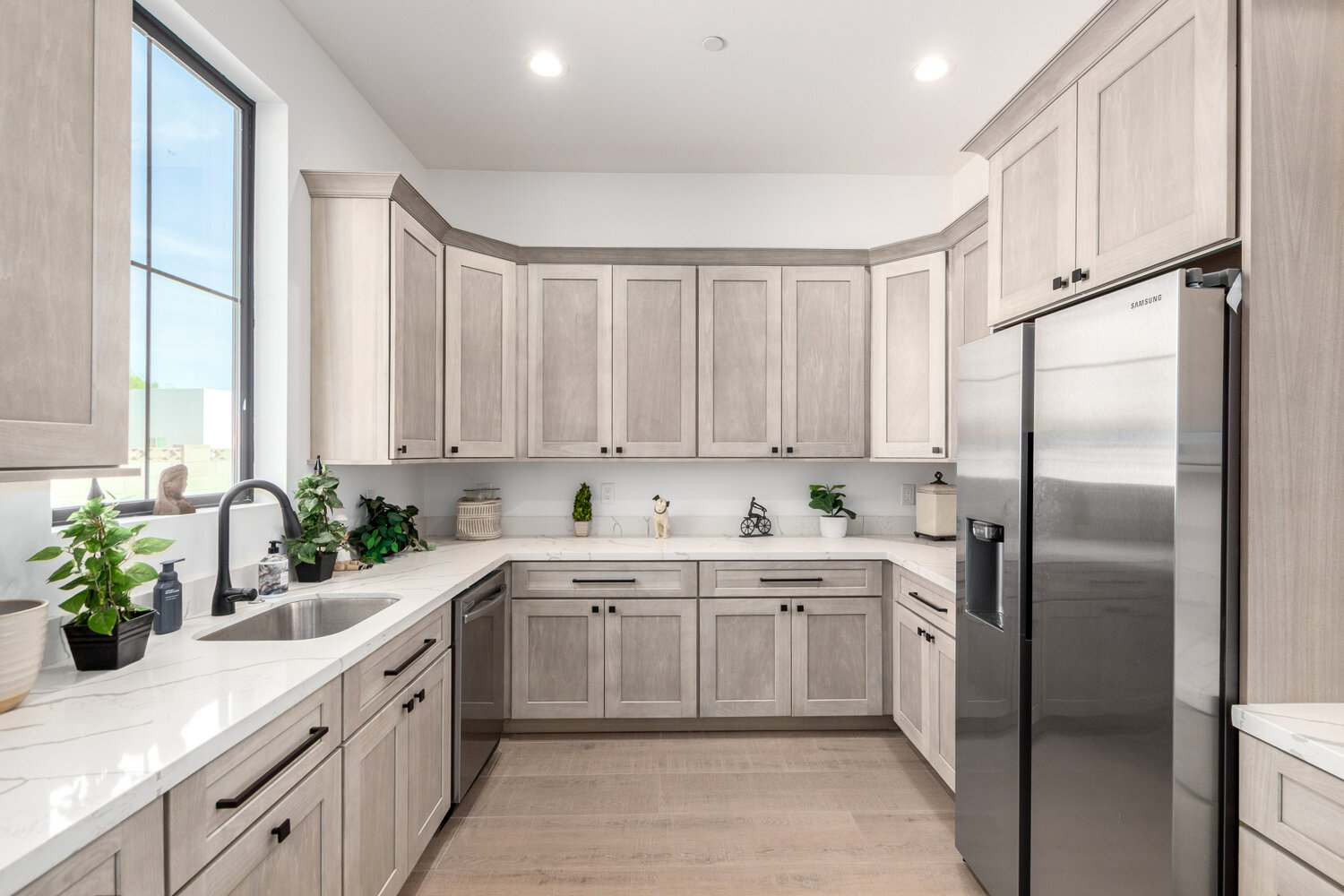 Stainless steel refrigerator and corner cabinetry in Scottsdale custom home pantry by Kitchens by Good Guys.