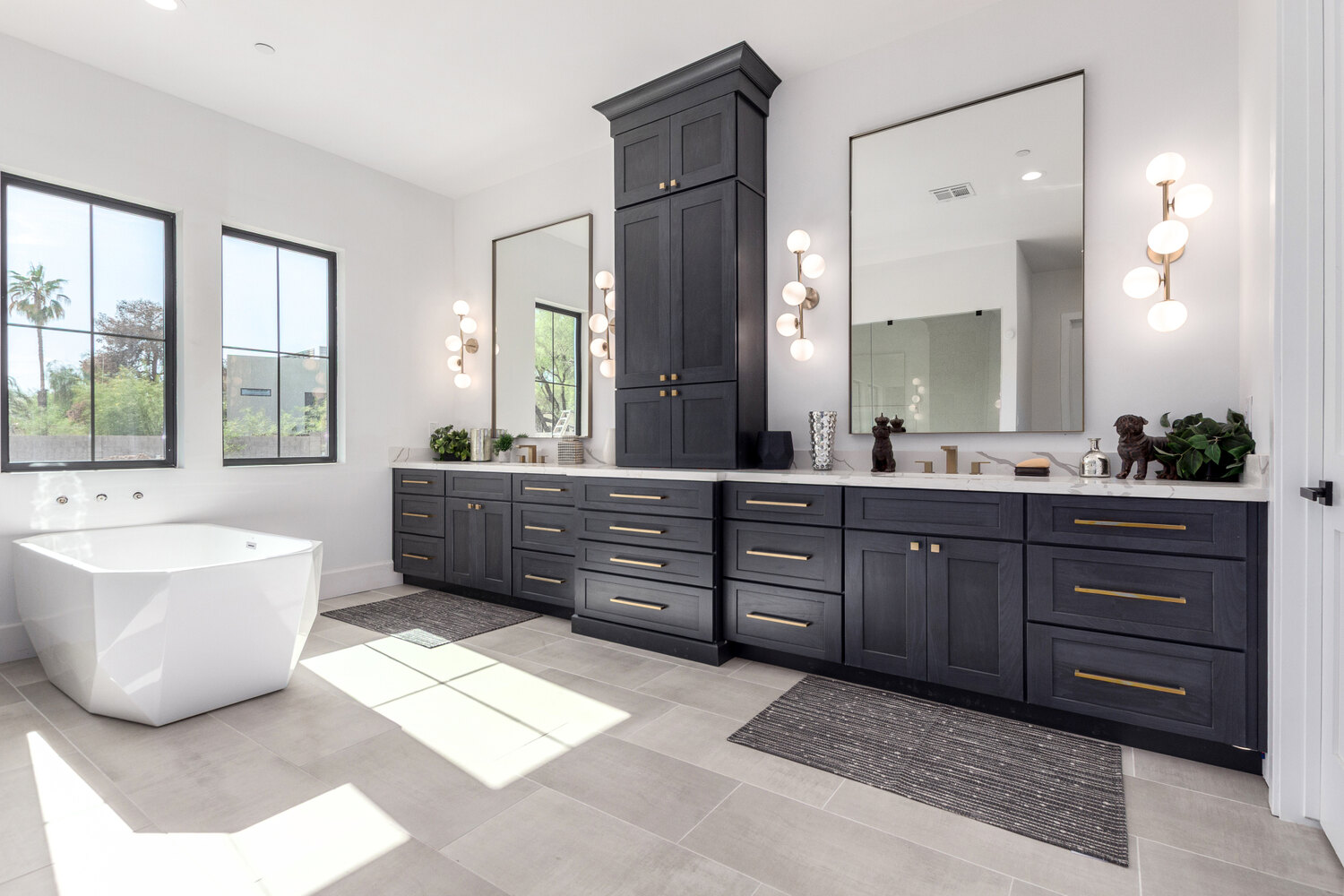 Bright bathroom remodel with dark vanity and gold pulls by Kitchens by Good Guys in AZ