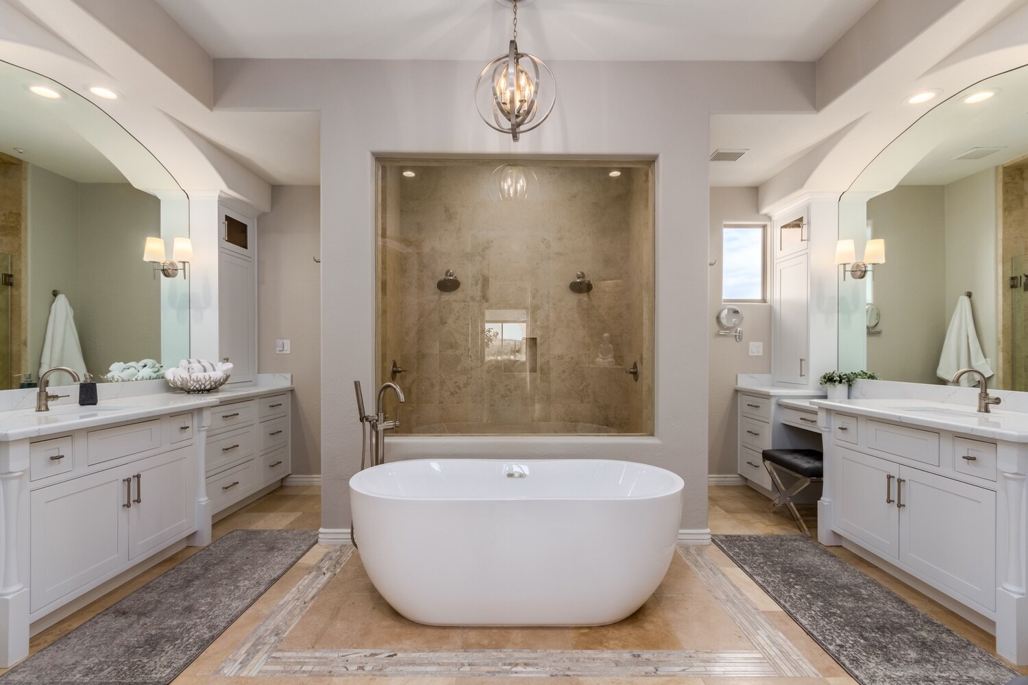 Custom bathroom design with center tub, marble shower, and elegant lighting in Scottsdale, AZ